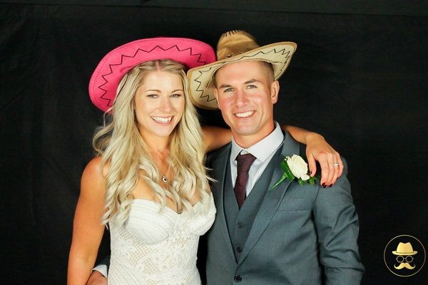 Bride and groom in a wedding photo booth